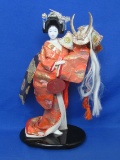 Japanese Geisha Doll on Stand – Holding a Hat w Horns & Long White Hair – 13” tall