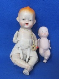 2 Ceramic Baby Dolls – 1 made in Japan with Cardboard Pacifier – 1 made in Germany with Bottle