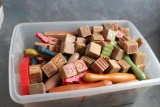 Plastic tote full of antique wood building blocks, lincoln logs & pieces, bowling pins