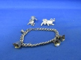 Lot Of 2 Metal Type Jewelry Items (1) Cowbell Charm Bracelet & (1) Hang-tight Cow Earrings -
