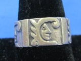 Silver Band Ring w Face Symbols – Made in Mexico – Signed – Size 10.75 – Weight is 7.1 grams