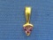 14 Kt Gold Pendant with Amethyst – 3/4” long – Weight is 1.2 grams
