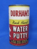 “Durham's Rock Hard Water Putty” w Graphic of Muscle Man – Cardboard & Tin – 5 3/4” tall