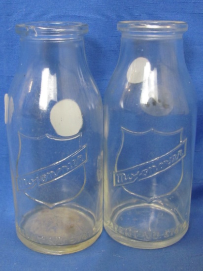 2 Mojonnier Bottles – appx 6” Tall – Each has a frosted etching spot on the