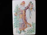 5 ½” x 3 ½” Purple Robed Santa Claus w Toys Dolls Christmas Tree Holly 1911 Postcard