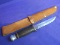 Vintage Hunting Knife  w/ Leather Sheath 0 Knife has a Handle made of Leather Rings