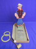 Popeye Pipe Toss Game  © 1935 by King Features Syndicate, Inc.