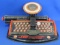 Tin Litho Junior Dial Typewriter by Marx – Black & Red – About 10 3/4” wide