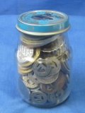 Jar of old tokens and foreign coins