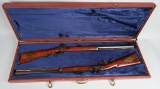 CASED PAIR OF THOMPSON CENTER FLINTLOCK RIFLES