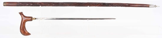 CARVED WOOD SWORD CANE