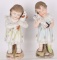 2-BISQUE FIGURES YOUNG GIRLS HOLDING ANIMALS