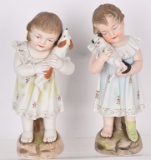 2-BISQUE FIGURES YOUNG GIRLS HOLDING ANIMALS
