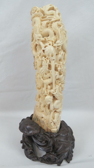 A carved and pierced vertical segment of Woolly Mammoth tusk decorated in the Oriental style