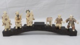 A set of six carved Woolley Mammoth tusk figurines in the Oriental style