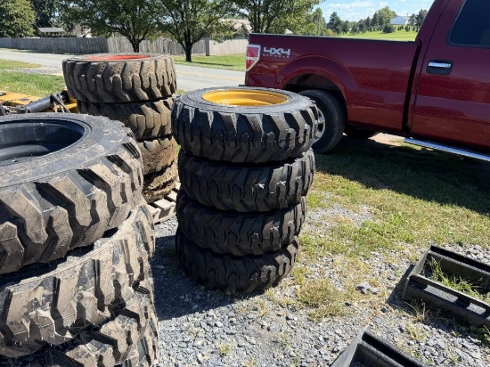 NEW 10-16.5 TIRES ON CATERPILLAR WHEELS
