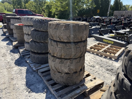 USED 10-16.5 TIRES ON CATERPILLAR WHEELS