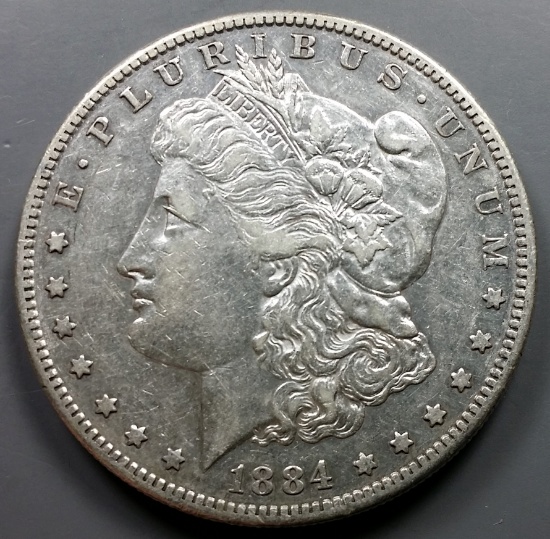 AU 1884-s Morgan Silver Dollar