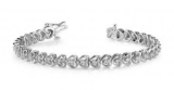 14K WHITE GOLD .90 CTW G-H VS2/SI1 FLOATING DIAMOND HEART BRACELET