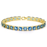 24.1 CT CREATED LONDON BLUE TOPAZ 925 STERLING SILVER TENNIS BRACELET WITH GOLD PLATED IN SQUARE SHA