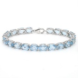 22.45 CT SKY BLUE TOPAZ 925 STERLING SILVER TENNIS BRACELET IN OVAL SHAPE