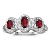 14k White Gold Oval Garnet And Diamond Three Stone Ring