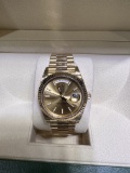 BRAND NEW DAY DATE OYSTERPETUAL IN GOLD 41MM COMES WITH BOX AND PAPERS