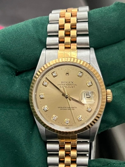 Used Rolex 36mm Oysterperpetual Datejust w/factory diamonds. This comes wit