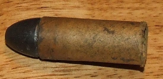 Early 58 cal bullet, pre load in a cardboard tube.