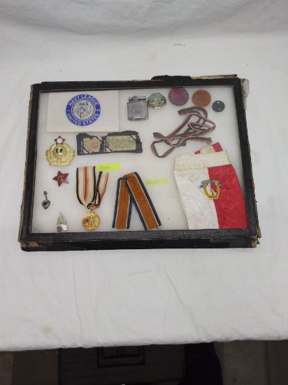 Display case of old military items