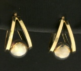 Half Hoop Designer Earrings With Suspended Sphere In 14k Gold