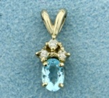 Sky Blue Topaz And Three Diamond Pendant In 14k White Gold
