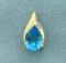 1 1/2ct Pear Shaped Swiss Blue Topaz And Diamond Pendant In 14k Yellow Gold