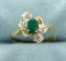 Emerald And Diamond Gold Flower Design Ring