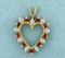 Ruby And Diamond Heart Pendant In 14k Yellow Gold
