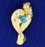 Manatee Pendant With Blue Topaz And Diamonds In 14k Gold