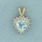 Sky Blue Topaz And Diamond Heart Pendant In 14k Yellow Gold