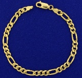 Italian Made Figaro Link Bracelet In 14k Yellow Gold