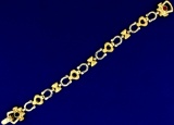 Italian Made Horseshoe And Heart Link Bracelet In 14k Yellow And White Gold