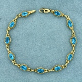 5 1/2ct Tw Swiss Blue Topaz Bracelet In 10k Yellow Gold