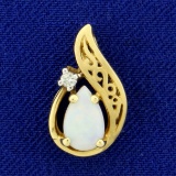 Pear Shaped Opal And Diamond Pendant In 14k Yellow Gold