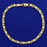 Hugs And Kisses Gold Bracelet In 14k Yellow Gold