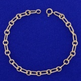 7 3/8 Inch Alternating Oval And Circle Cable Link Bracelet In 14k Yellow Gold