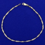 10 Inch Twisting Curb Link Anklet In 14k Yellow Gold