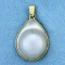 Bezel Set Mabe Pearl Pendant In 14k Yellow Gold