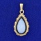 Tear Drop Shaped Opal Doublet Pendant In 14k Yellow Gold