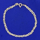 Italian-made Braided S Link Bracelet In 14k Yellow And White Gold