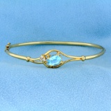 1.5ct Sky Blue Topaz And Diamond Bangle Bracelet In 14k Yellow Gold