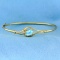 1.5ct Sky Blue Topaz And Diamond Bangle Bracelet In 14k Yellow Gold