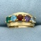 Emerald, Aquamarine, Purple Sapphire, Garnet, And Blue Topaz Ring In 14k Yellow Gold